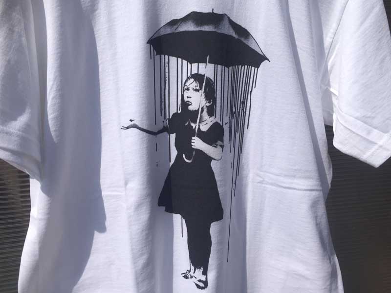 Vi Banksy oNV[@XeVA[g@OtBeB[TVc from UK Umbrella Girl Nola S/S Tee